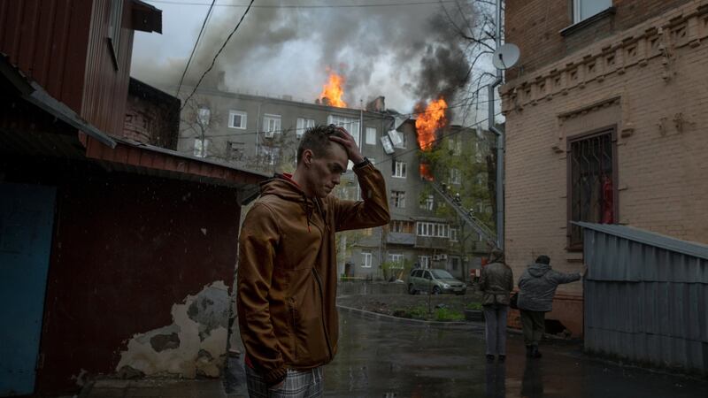 An apartment building burns after a rocket barrage that struck central Kharkiv, Ukraine. Photograph: Tyler Hicks/The New York Times