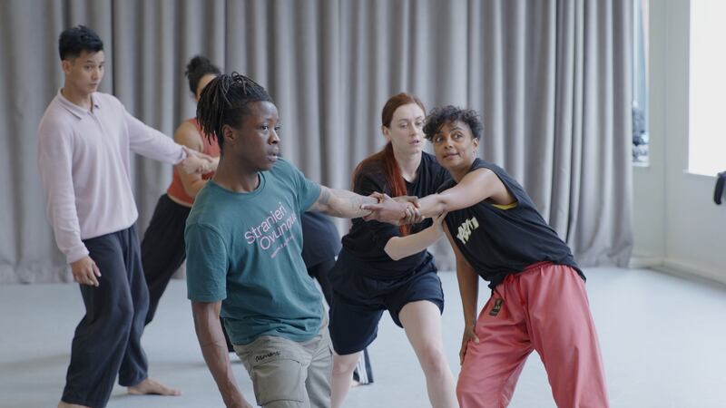 One of Luail's resident choreographers, Mufutau Yusuf, with Sarah Cerneaux, right, and Emily Terndrup, back, teaching movement material to auditioning dancers in Dublin in July 2024. Photograph: Nicky Larkin