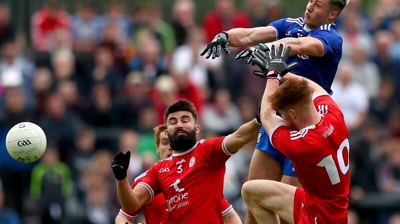 Tyrone’s Tiernan McCann and Cathal McShane with Dessie Ward of Monaghan during the visitors’ victory at Healy Park in Omagh. Photograph: James Crombie/Inpho