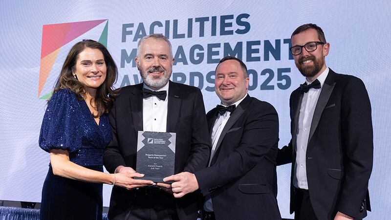 Daniel Keane, strategic partnership manager at Synergy Security Solutions, presents the property management team of the year award to the Aramark Property - ILAC team