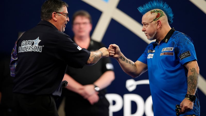 Peter Wright beat Gary Anderson in a heavyweight semi-final clash. Photograph: Luke Walker/Getty