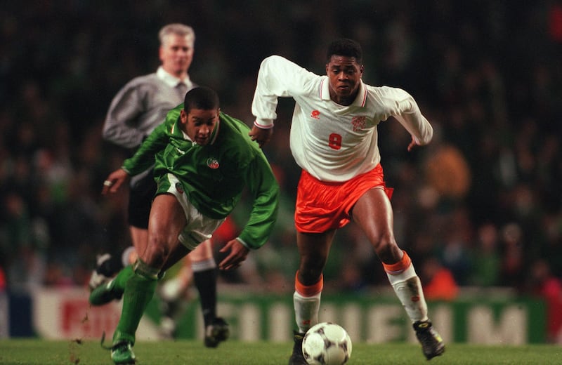 Patrick Kluivert skips past Phil Babb for the Netherlands against Ireland in December 1995. Photograph: Billy Stickland/Inpho
