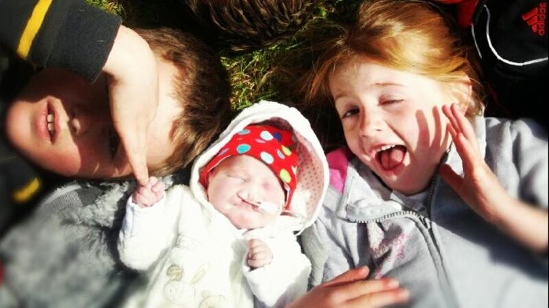 Muireann with two of her siblings.