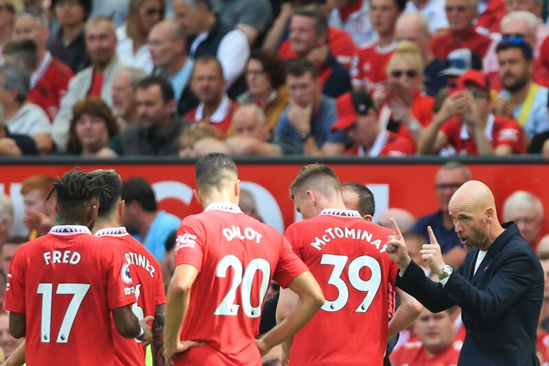 Manchester United's Dutch manager Erik ten Hag speaks to his players during the defeat. Photograph: Lindsey Parnaby/AFP via Getty Images