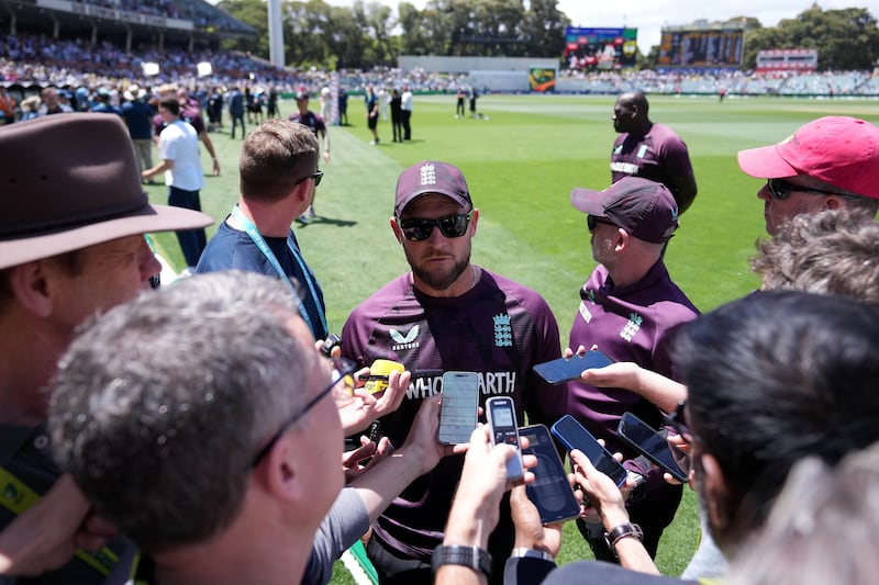 England head coach Brendan McCullum (centre) is interviewed by the journalists on day five of the Ashes at the Adelaide Oval. Photograph: Robbie Stephenson/PA Wire