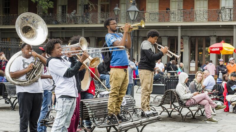 A group of young men play jazz music   in the French quarter of New Orleans. Photograph: iStock