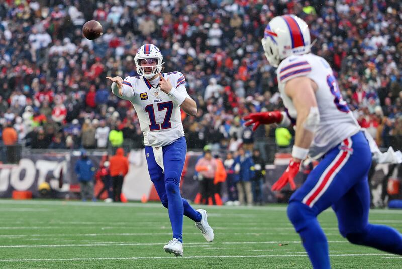 Josh Allen of the Buffalo Bills tosses a touchdown pass to Dawson Knox during the game between against the New England Patriots. Photograph: Fred Kfoury III/Icon Sportswire via Getty Images