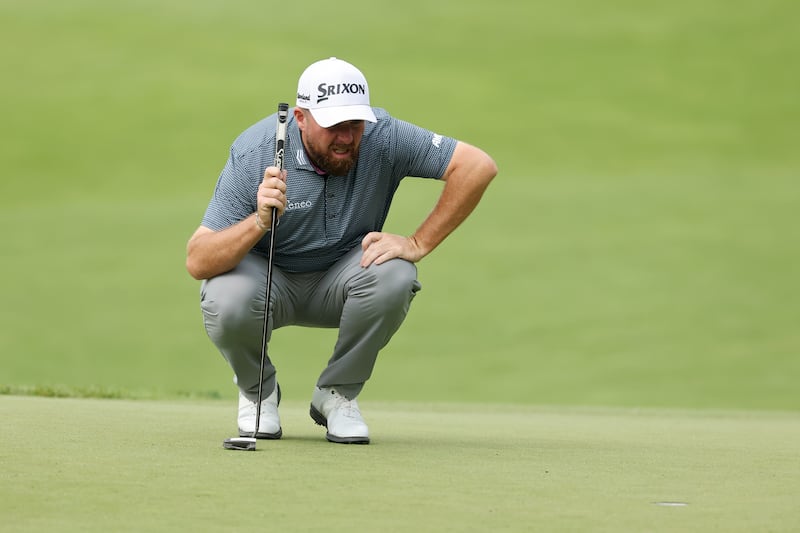 Shane Lowry of Ireland lines up a putt on the second green. Photograph: Michael Reaves/Getty