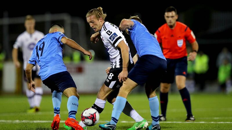 Dundalk’s John Mountney is challenged by  Greg Sloggett and Conor Davies of UCD. during the FAI Cup semi-final at Oriel Park. Photograph: Ryan Byrne/Inpho