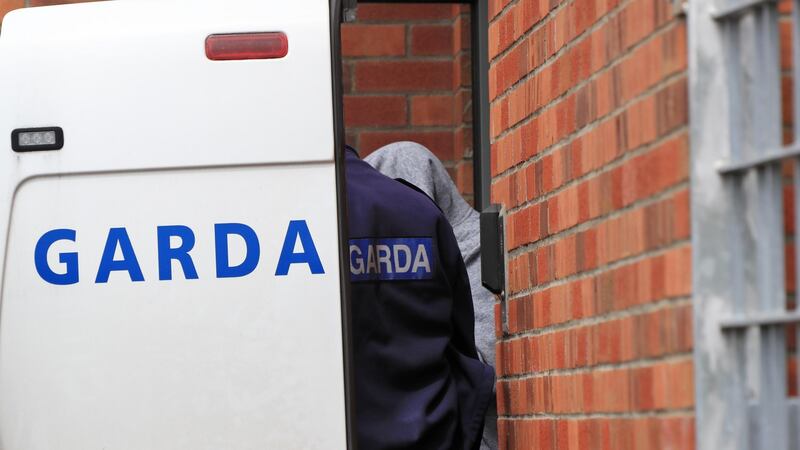 Kieran Greene (32) of Mountain View Park, Rathfarnham (in grey hoodie), being brought into Tallaght District Court this afternoon. Photograph: Colin Keegan/Collins Dublin