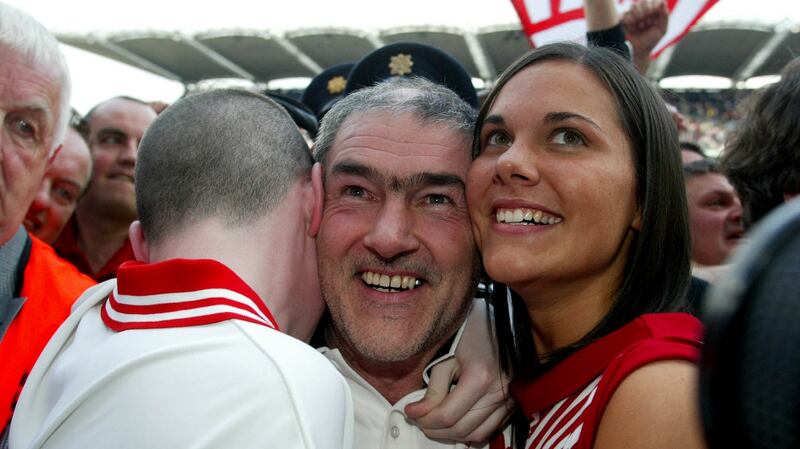 Mickey Harte with his son Matthew and daughter  Michaela after Tyrone’s 2003 All-Ireland victory, the county’s first. Photograph: Morgan Treacy/Inpho