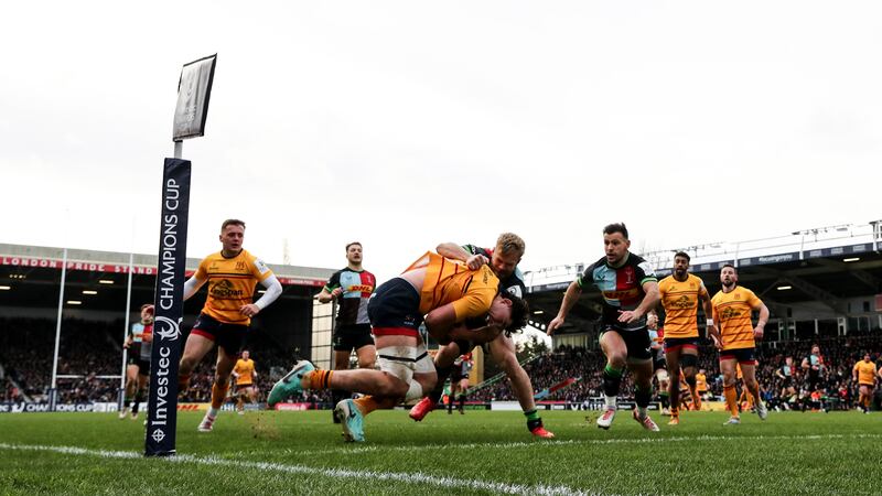 Ulster's David McCann scores a try despite the attempts of Tyrone Green and Danny Care of Harlequins to stop him. Photograph: Ben Brady/Inpho