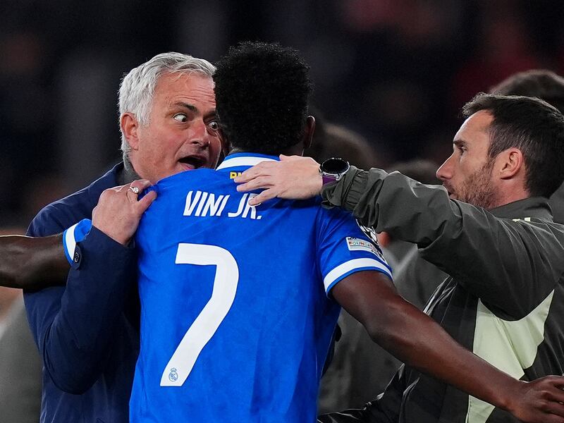 José Mourinho speaks to Real Madrid's Vinícius Júnior while play is stopped during the Champions League playoff. Photograph: Angel Martinez/Getty Images