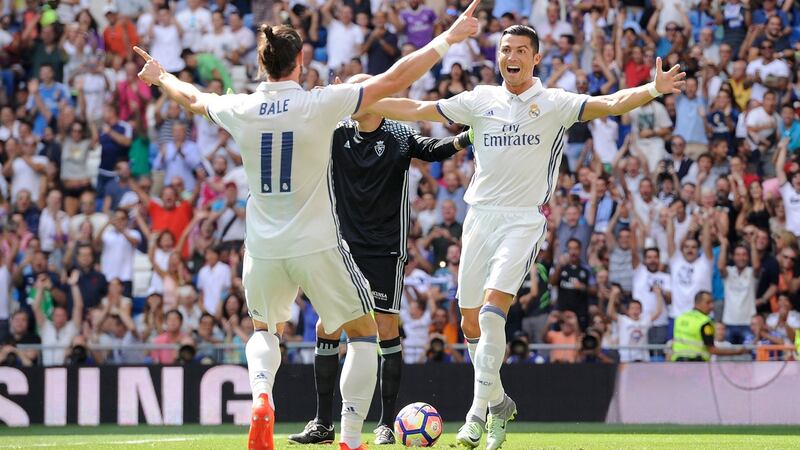 Cristiano Ronaldo celebrates with Real Madrid team-mate Gareth Bale after scoring opening goal during the La Liga match against Osasuna at Estadio Santiago Bernabeu  in Madrid. Photograph: Denis Doyle/Getty Images