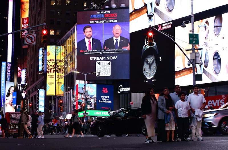 A screen in Times Square showing the CBS vice-presidential debate between US senator and Republican vice presidential candidate JD Vance and Minnesota governor and Democratic vice-presidential candidate Tim Walz. Photograph: Kena Betancur/AFP
