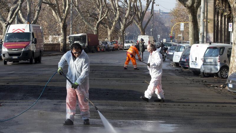 Cleaning the streets of Rome of bird dung. Photograph: Claudio Peri/EPA