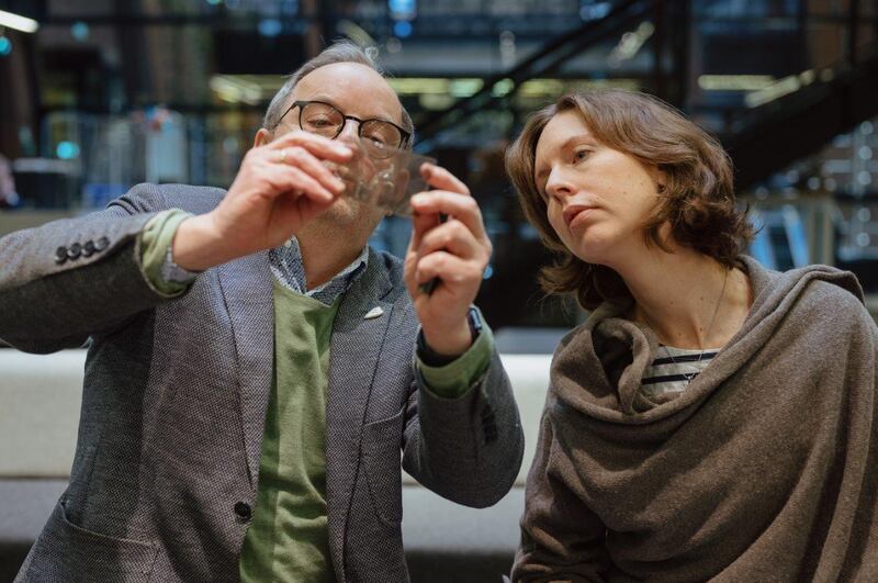 Maciej Grzywaczewski and Zuzanna Schnepf-Kołacz inspect the photographic film. Photograph: M Jazwiecki/Muzeum Historii Zydow Polskich