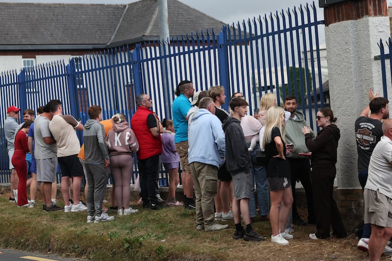 Members of the public outside Casement Aerodrome, Baldonnell, where the Government plane carrying Daniel Kinahan arrived on Sunday. Photograph: Damien Eagers/PA