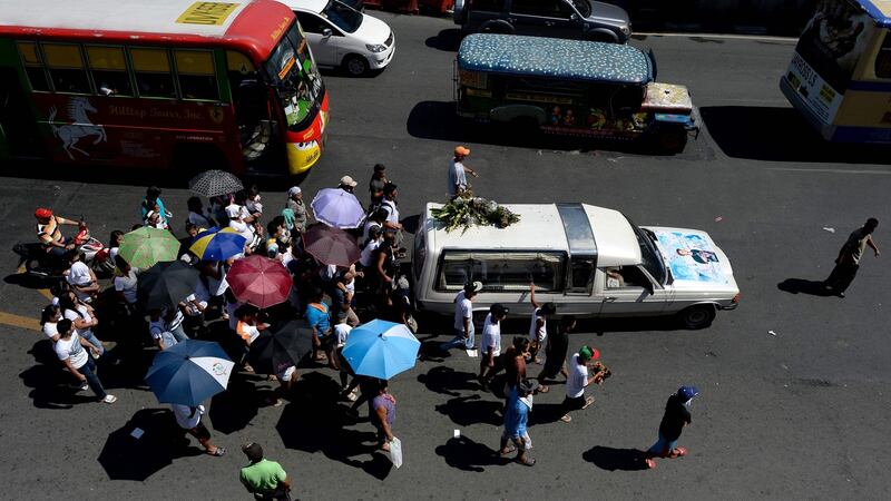 Relatives of Michael Siaron follow a hearse carrying his coffin during his funeral ceremony  in Manila on Wednesday. Photograph: Noel Celis/AFP/Getty Images