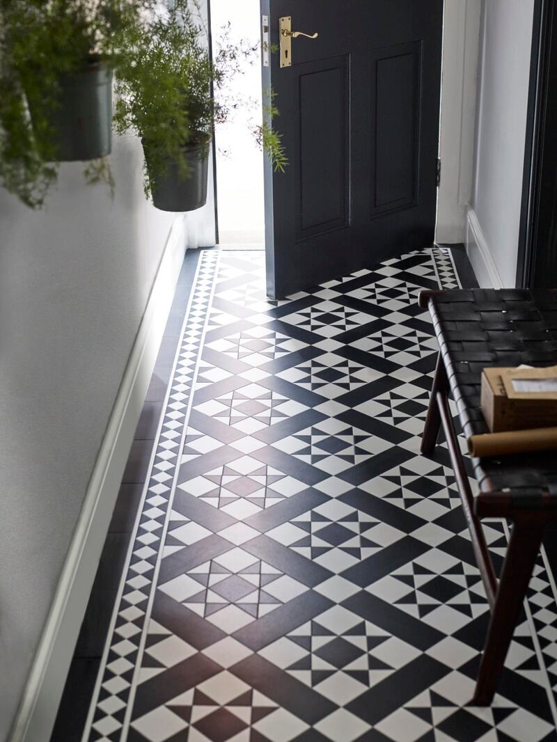 A chic entrance hall creates a great first impression with vinyl floor tiling from the Amtico Décor collection in Mono.