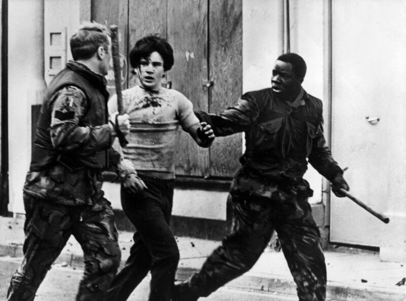 A teenager is arrested by British troops during a civil rights demonstration in Belfast. Photograph: Keystone/Getty