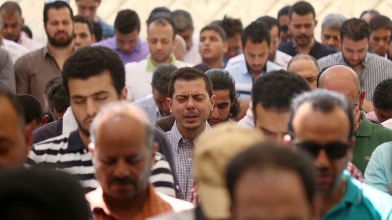 Relatives and friends of passengers of the EgyptAir plane that crashed in the Mediterranean, pray on Friday at the  Abou Bakr el-Sedek mosque in Cairo. Photograph: Mohamed Meteab/AFP/Getty Images