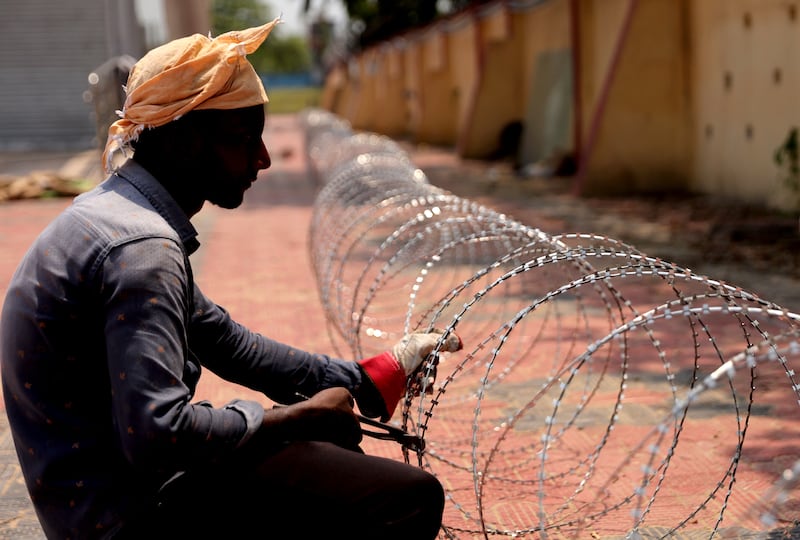 Barbed wire-fencing is put in place at Kolkata Airport, India. Photograph: Piyal Adhikary/EPA
