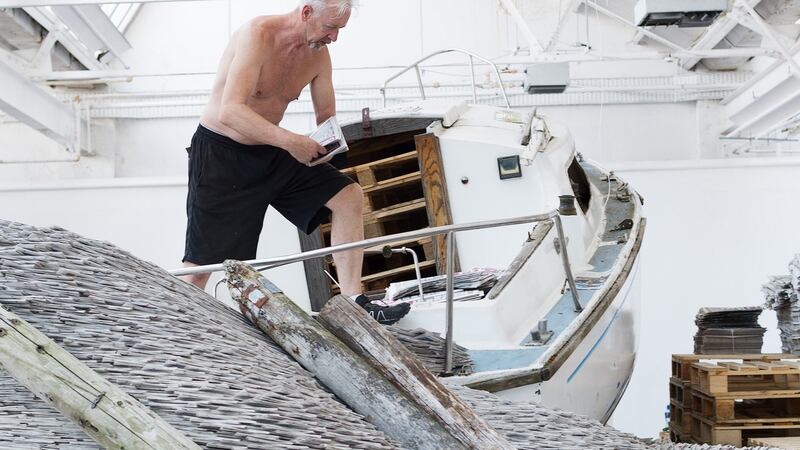 David Mach working on his newspaper installation.  Photograph: Andrew Downes, xposure