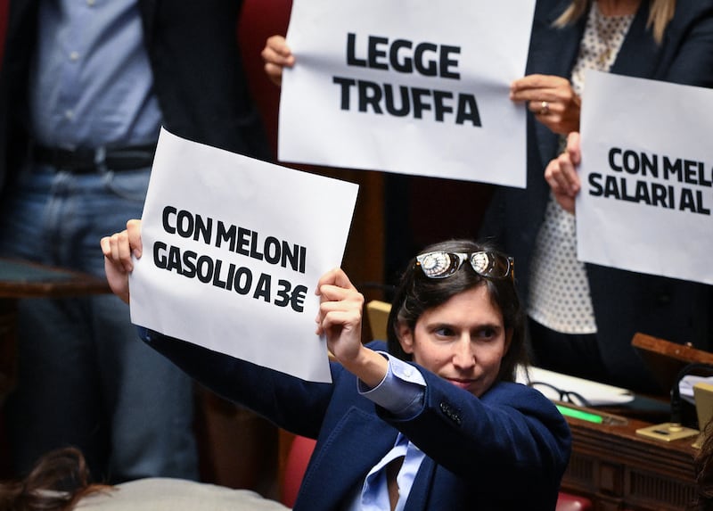 Secretary of the Democratic Party (PD) Elly Schlein holds a sign reading "With Meloni, gasoline at €3" in Italy's lower house of parliament. Photograph: Tiziana Fabi/AFP/Getty Images