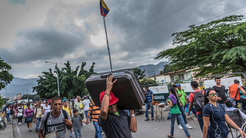Venezuelans enter Colombia at the immigration check point on the Simón Bolívar Bridge, just outside Cúcuta, on February 1st. Photograph:  Juan Arredondo/The New York Times