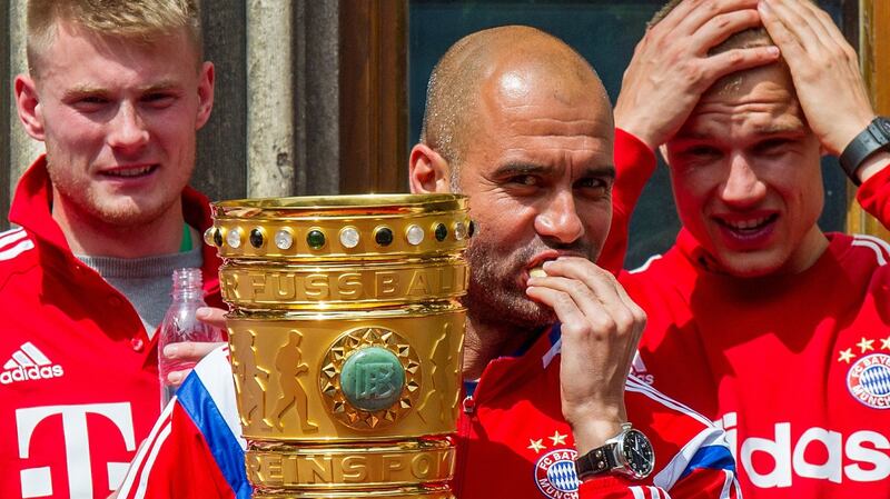 Head coch Pep Guardiola holds the trophy after Bayern Munich’s German cup win over Borussia Dortmund ikn Berlin in  2014. Photograph: Marc Mueller/AP