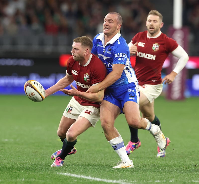 Finn Russell of the British & Irish Lions passes the ball as Dyaln Pietsch tackles. Photograph: David Rogers/Getty Images
