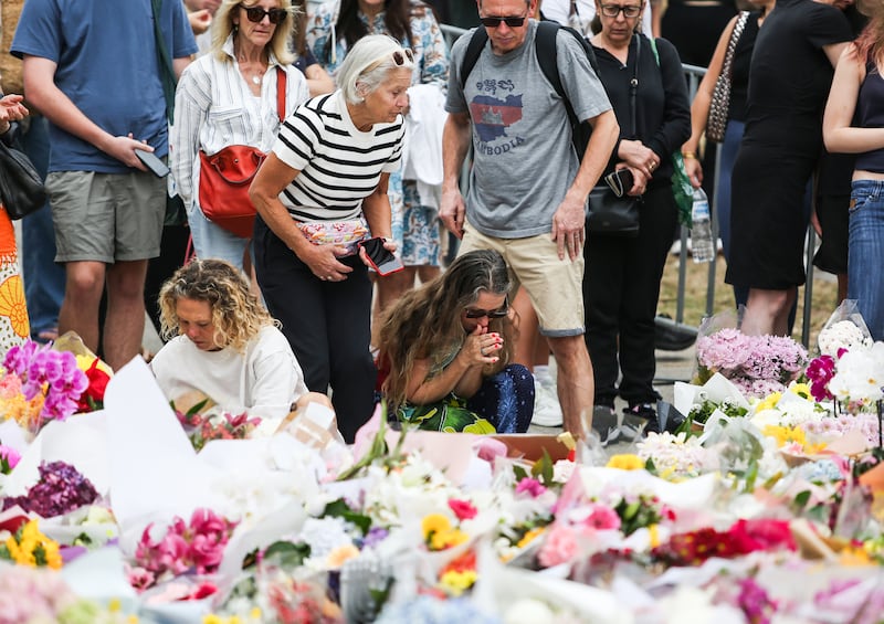 People place flowers at the Bondi Pavilion site, Sydney. Photograph: Evan Treacy for The Irish Times