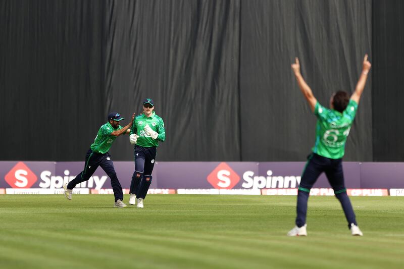 Ireland's Lorcan Tucker (centre) celebrates after catching out India's Ishan Kishan off the bowling of Matt Hollard (right) during the first T20 international at Stormont, Belfast. Photograph: Liam McBurney/PA Wire