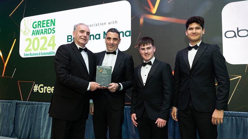 Fergus Elebert, regional director at Veolia, presents the green life sciences award to AbbVie team