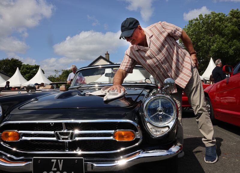 Nino Forte, polishing a Honda S800 at the Vintage and Classic Cars Show, at the Dalkey Vintage Festival. Photograph: Dara Mac Dónaill 