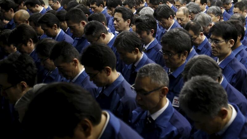Tepco workers take part in a moment of silence to mark the five-year anniversary of the 2011 earthquake and tsunami that  triggered the world’s worst nuclear disaster since Chernobyl in 1986. Photograph: Yuya Shino/Reuters