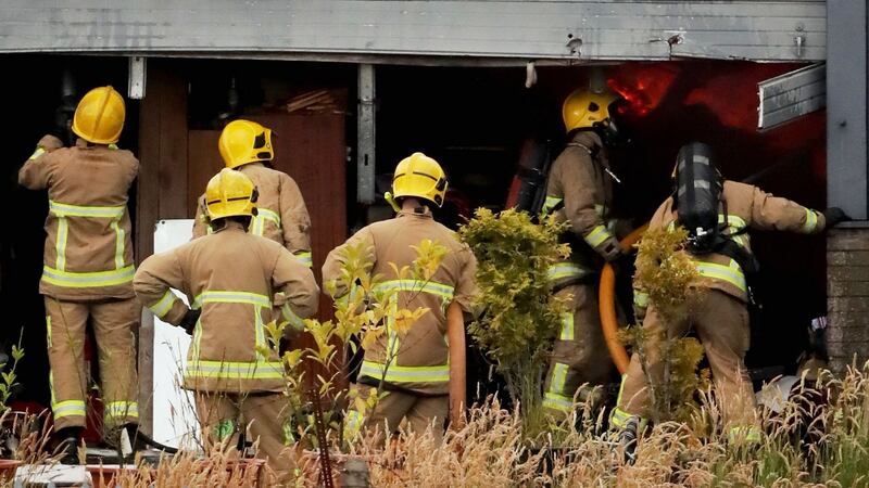 Fire crews battle the  factory fire at Belfast Crystal. Photograph: PA