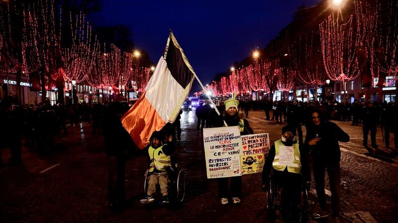 “Yellow vest” (gilets jaunes) anti-government demonstrators protest on the Champs Elysee in central Paris on Saturday. Photograph: Sameer Al-Doumy/AFP/Getty Images