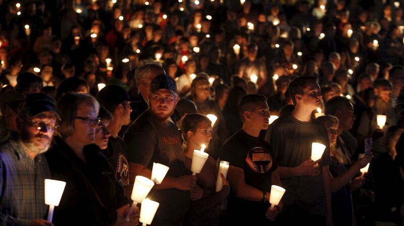 People take part in candlelight vigil late on October 1st following the mass shooting at Umpqua Community College in Roseburg, Oregon. Photograph: Steve Dipaola/Reuters