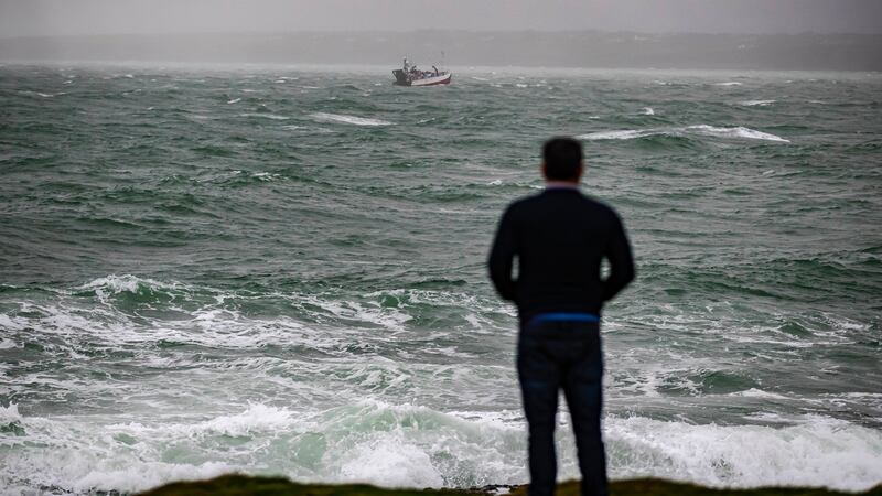 Watching the search effort for a missing fisherman off  Hook Head, Co Wexford on Sunday. Photograph: Patrick Browne