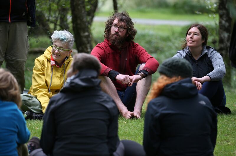 Forest bathing training: Ciaran Thorton (centre) taking part in the course in Glendalough forest, Co Wicklow,  led by Shirley Gleeson (right). Photograph: Crispin Rodwell