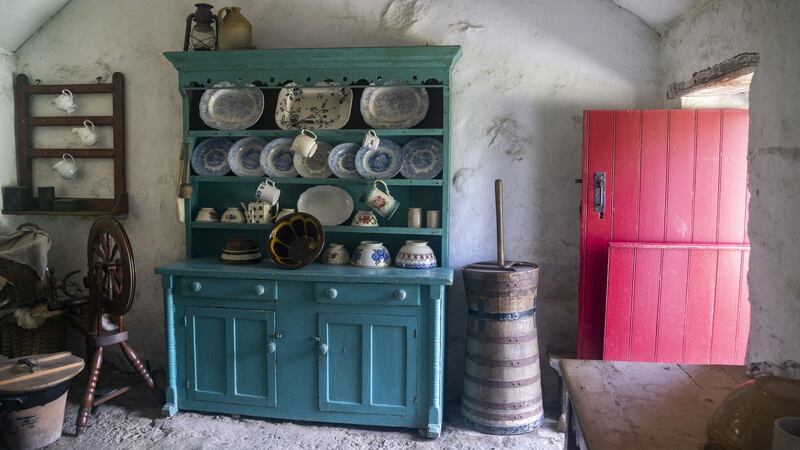 Dresser from Ballyveaghmore farm kitchen, with flour-bag ceiling and red half door. Photograph:  Claudia Kinmonth, courtesy of the Ulster Folk Museum