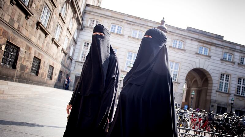 Women in niqabs at Christiansborg Palace in Copenhagen, Denmark, after the Danish parliament banned the wearing of face veils in public in May 2018.
