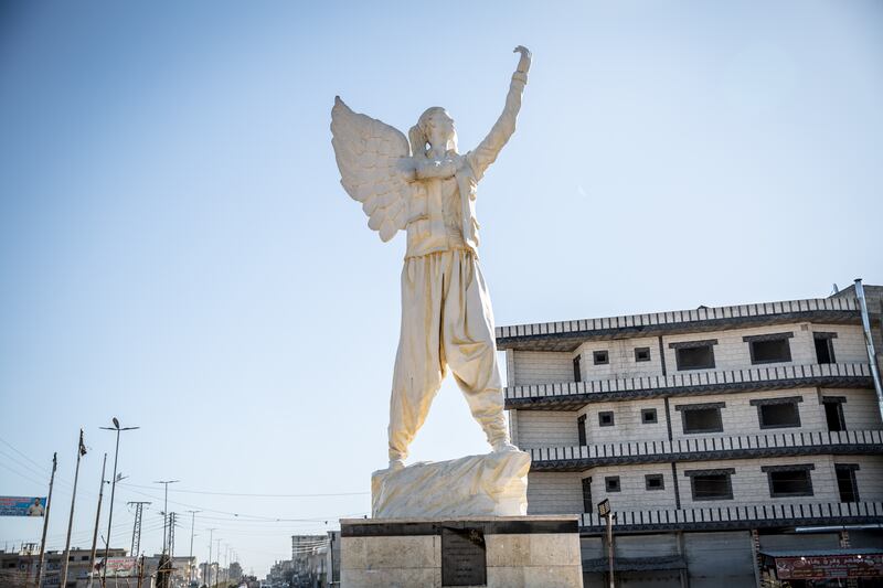 A statue in central Kobani memorialises Arin Mirkan, a YPJ fighter who blew herself up to avoid being captured by Islamic State. Photograph: Sally Hayden