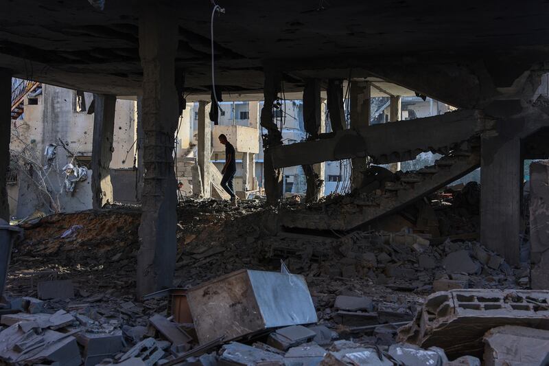 A Palestinian man on Wednesday inspects the damage around a house hit in an Israeli strike a day earlier in western Beit Lahia in the northern Gaza Strip. Photograph: Omar Al-Qatta/AFP via Getty Images          