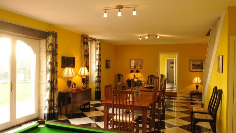 Living/dining area of Vincent and Coco Hearne’s renovated farmhouse in Aubeterre-sur-Dronne, France