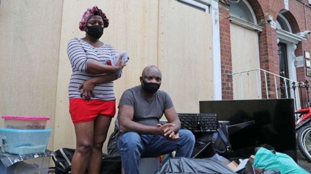 Theresa Chimamkpam and Elias Jegede with their belongings after being evicted from Berkeley Road, Dublin, on Wednesday. Photograph: Nick Bradshaw