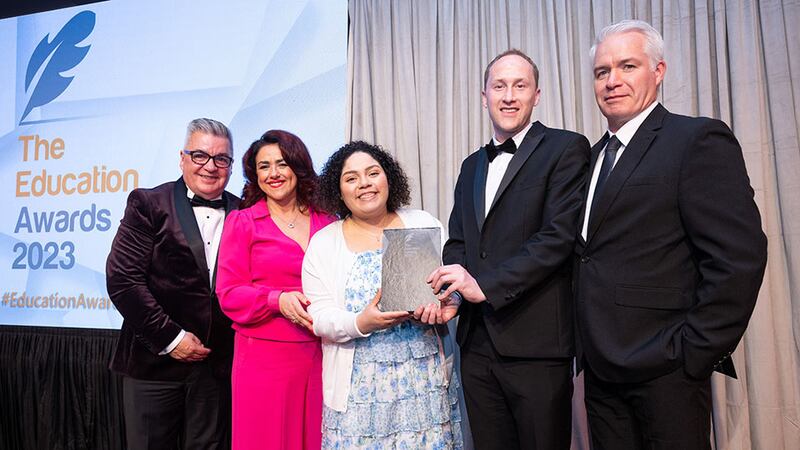 Denise McMorrow, awards judge, presents the International Engagement Award to National College of Ireland team