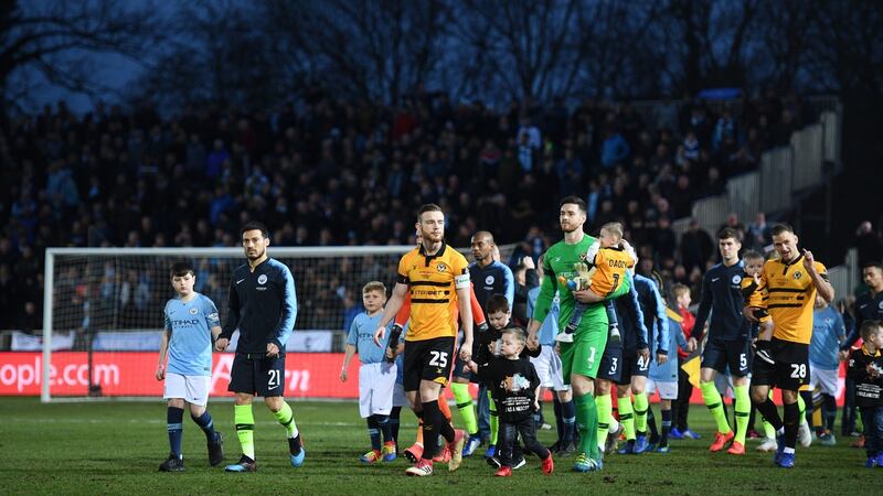 Mark O’Brien leads out Newport against Manchester City in the FA Cup in February 2019. Photograph: Harry Trump/Getty